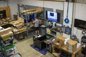 Sandro Vega from RoomReady working at his installation station.